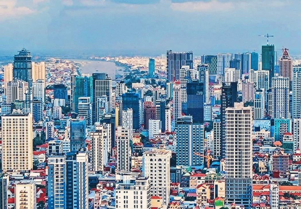 Panoramic view of Phnom Penh high-rise buildings and river in January 2022